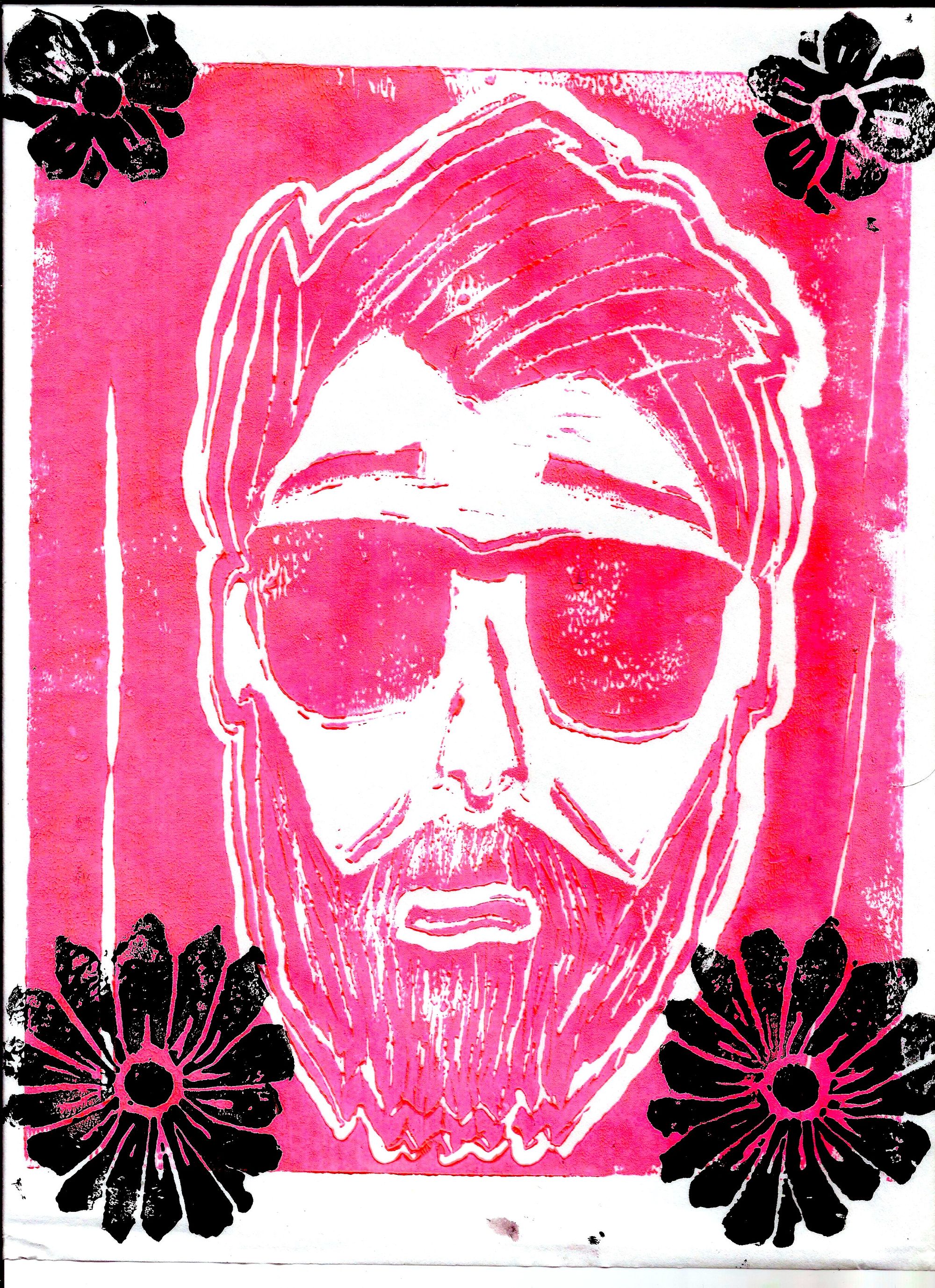 A linocut print of my face, stylized, in sunglasses. Made with hot pink ink, with black flowers on each corner of the image.