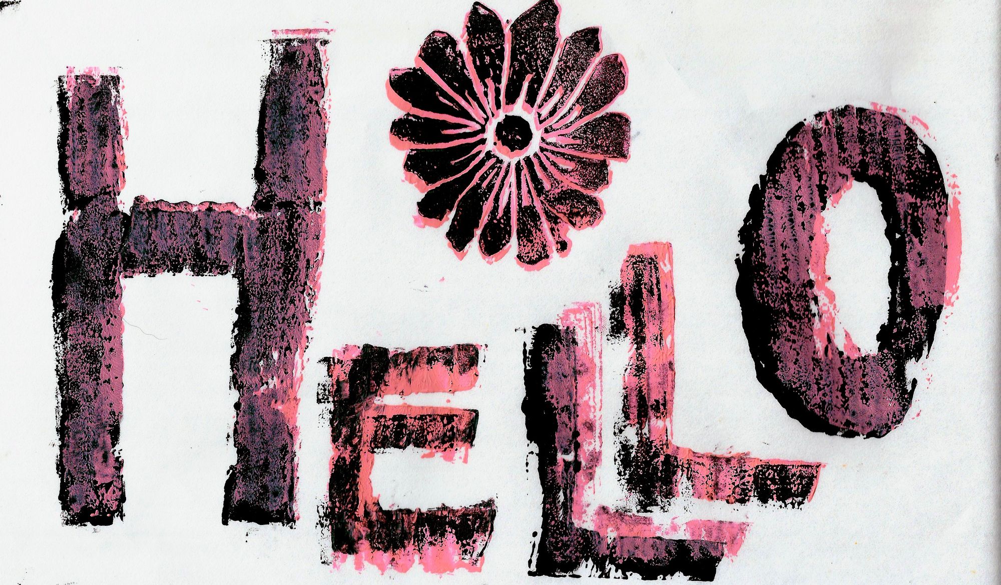 A block-print that says "Hello" in black and pink ink with a black and pink flower above the text